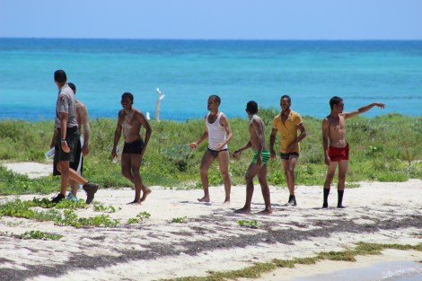 Some of the first arrivals of a 23-person group of Cuban immigrants make first contact with a park ranger. Photo Source: Matthew Toro. August 4, 2015.