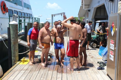 The men were in great spirits as they washed the saltwater from their bodies. Photo Source: Matthew Toro. August 4, 2015.