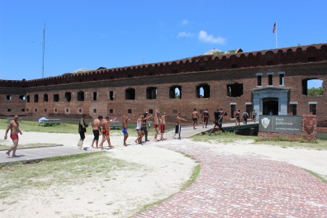 The men are escorted into historic Fort Jefferson to receive initial care and rest. Photo Source: Matthew Toro. August 4, 2015.